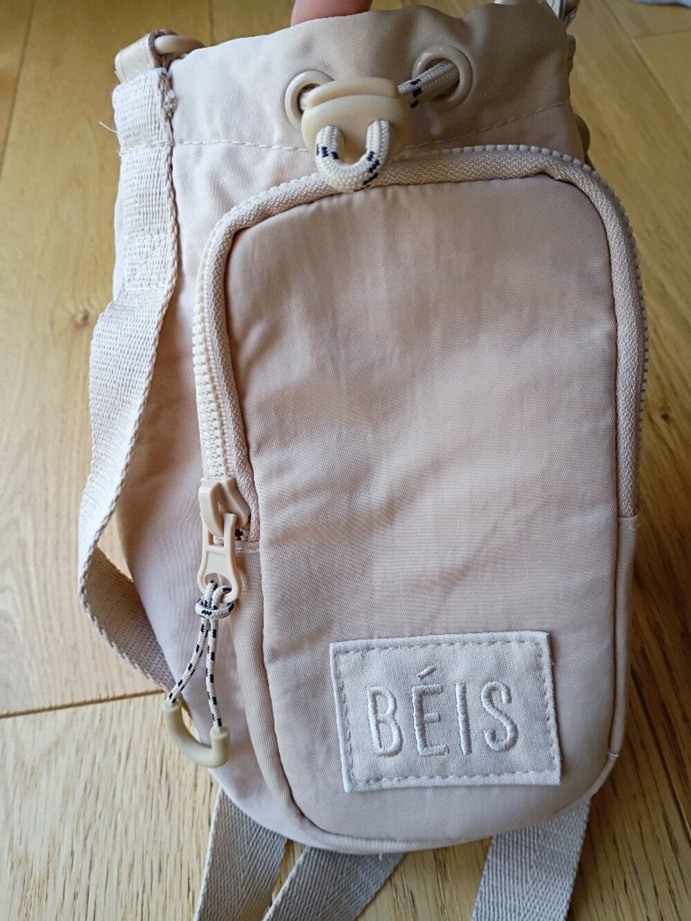 Beis the water bottle sling bag in beige